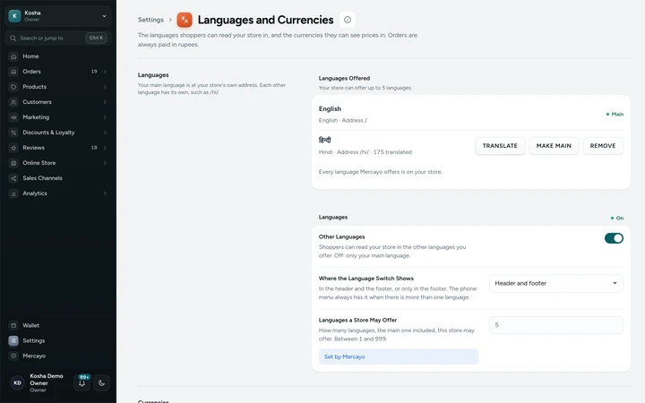 Settings → Languages and Currencies, with English as the main language and Hindi offered, on Kosha, a demo store on Mercayo.